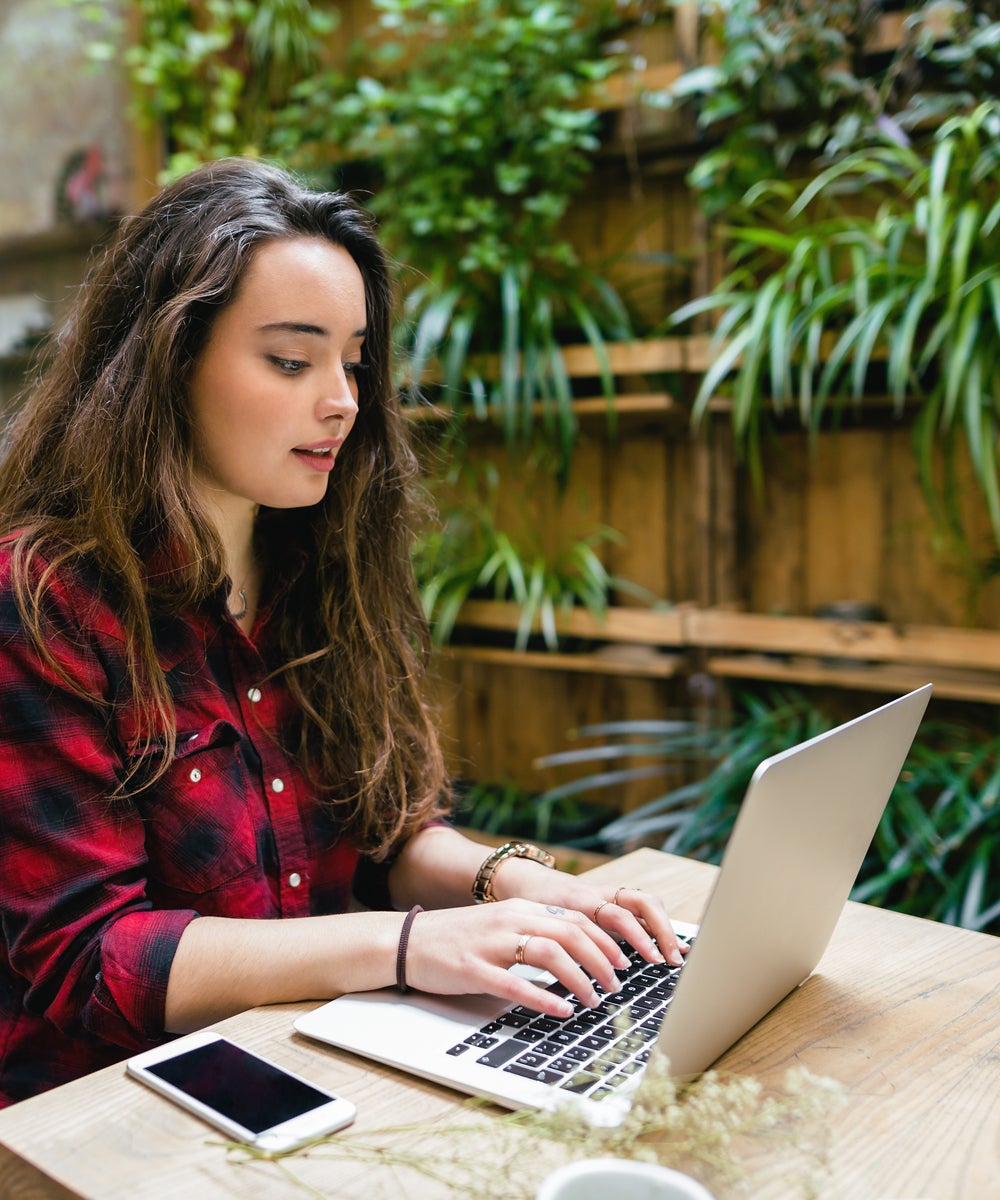 person working on laptop outside